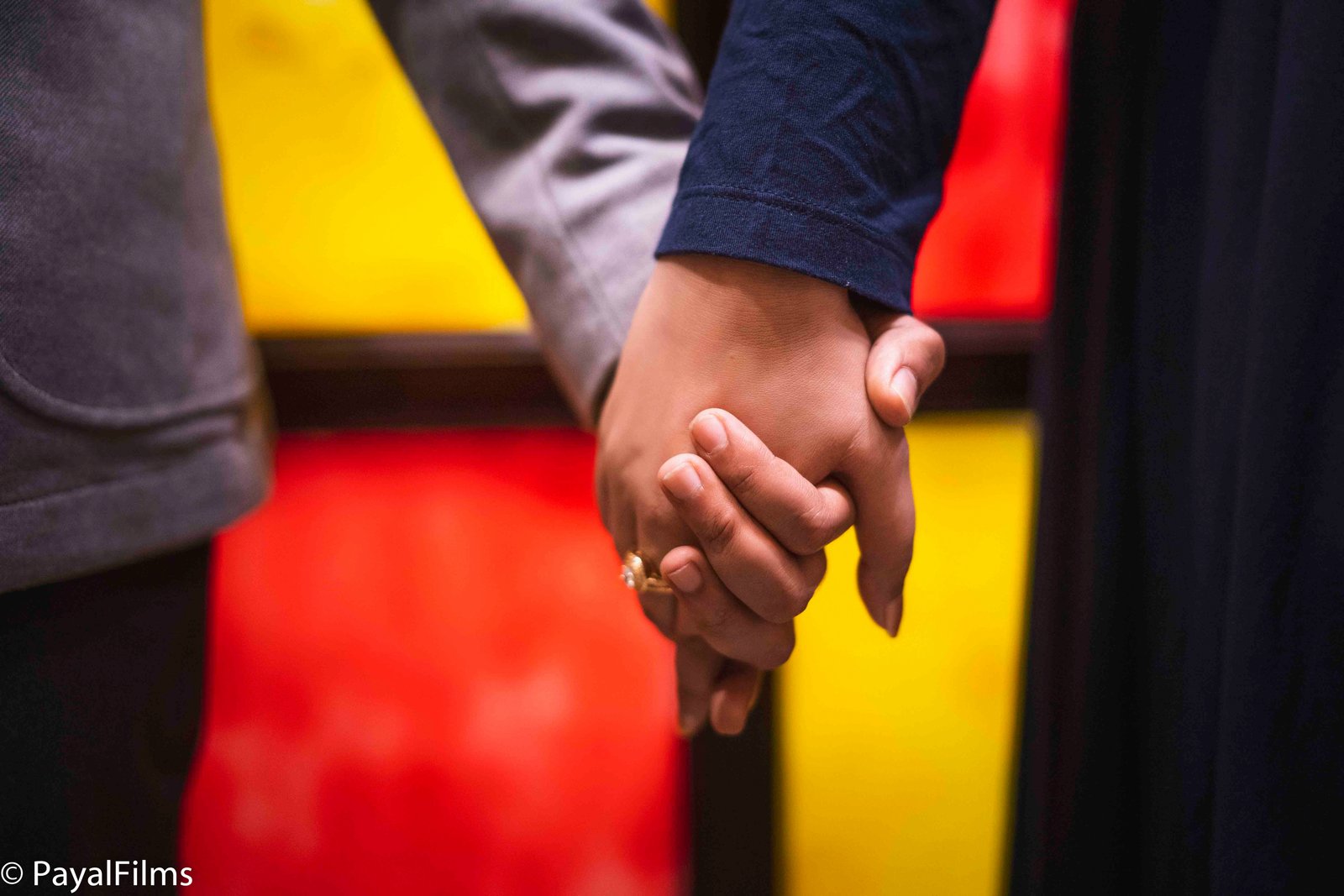 A romantic close-up of a couple holding hands, captured by Payal Films in Khagaria.