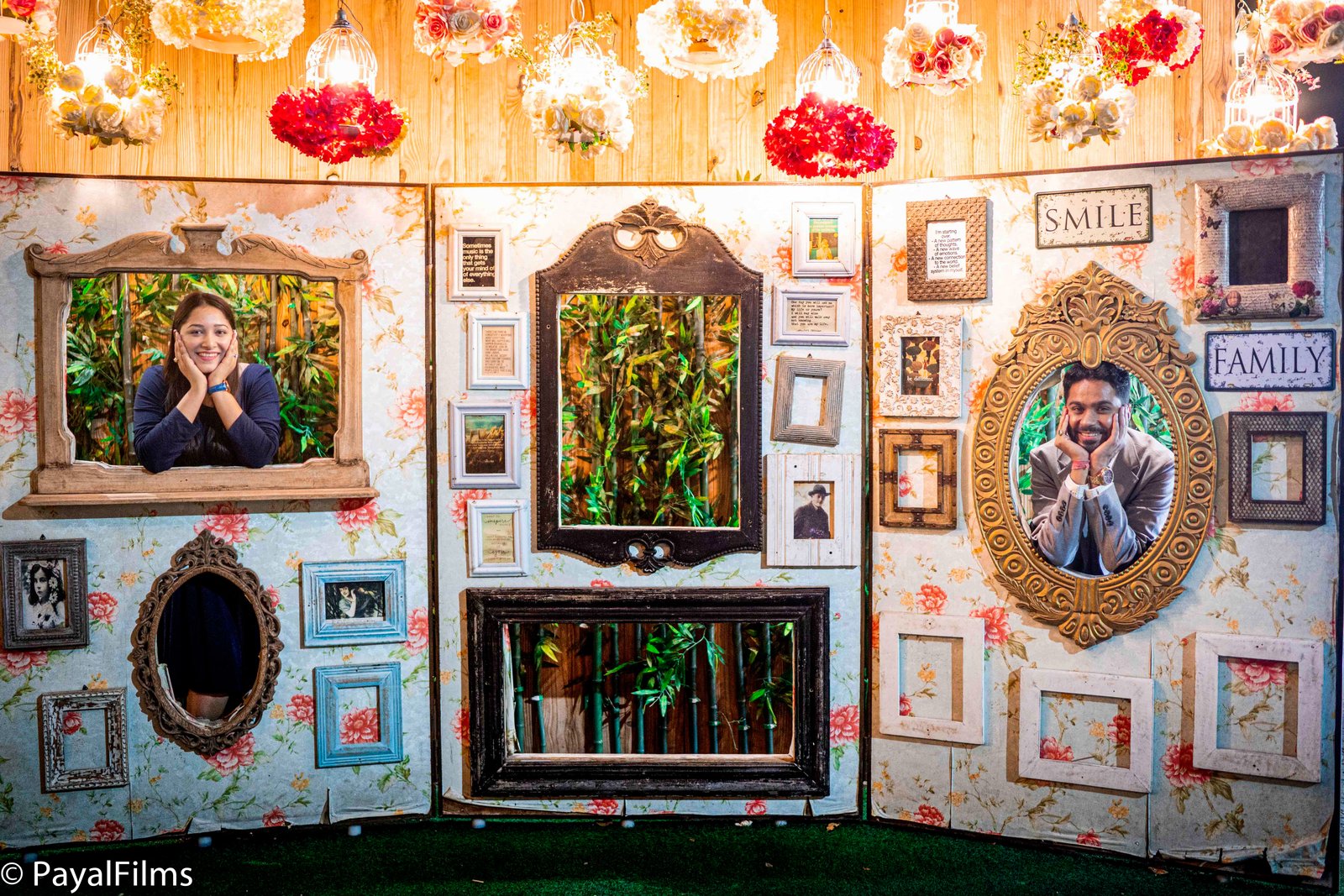 Couple playfully posing inside vintage decorative picture frames during an Indian pre-wedding shoot by Payal Films.