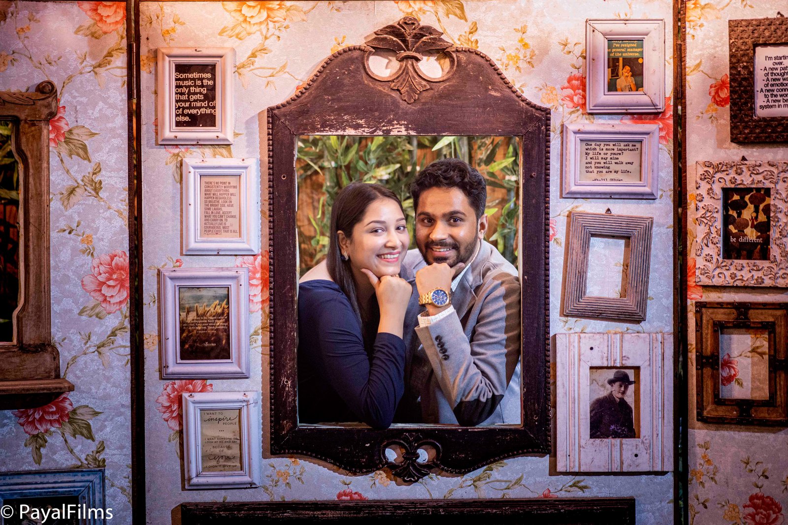 Smiling couple posing inside a vintage mirror frame captured by Payal Films in Khagaria