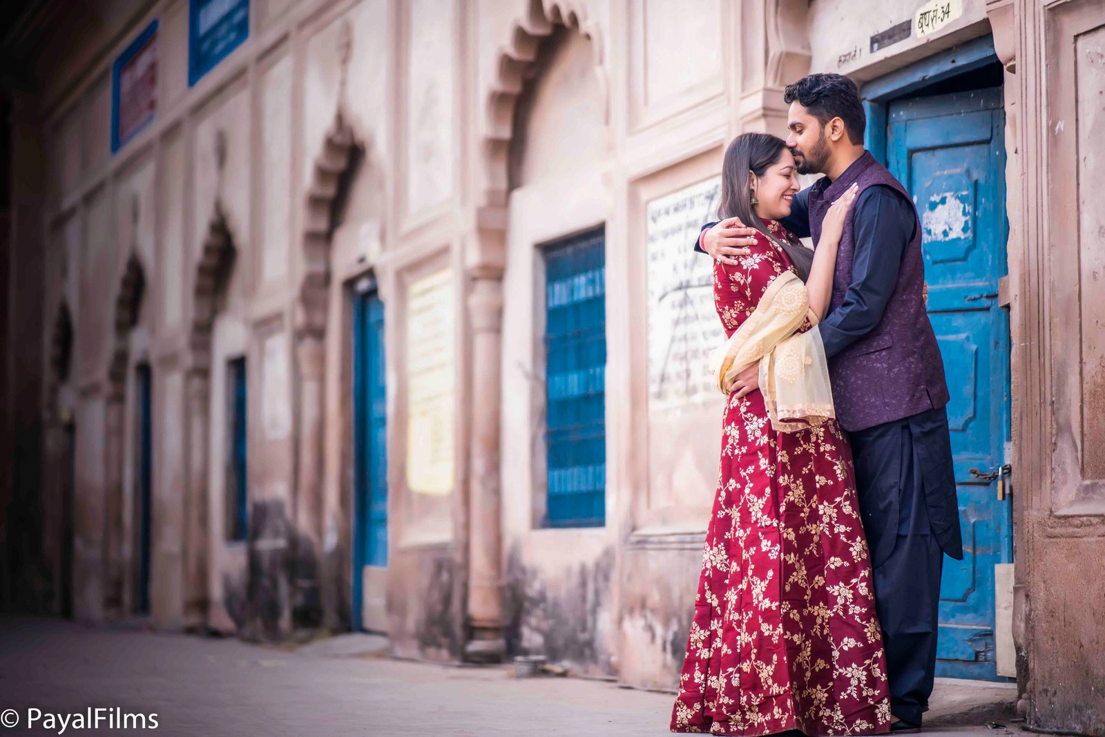 Romantic couple embrace traditional attire khagaria by Payal Films Bihar