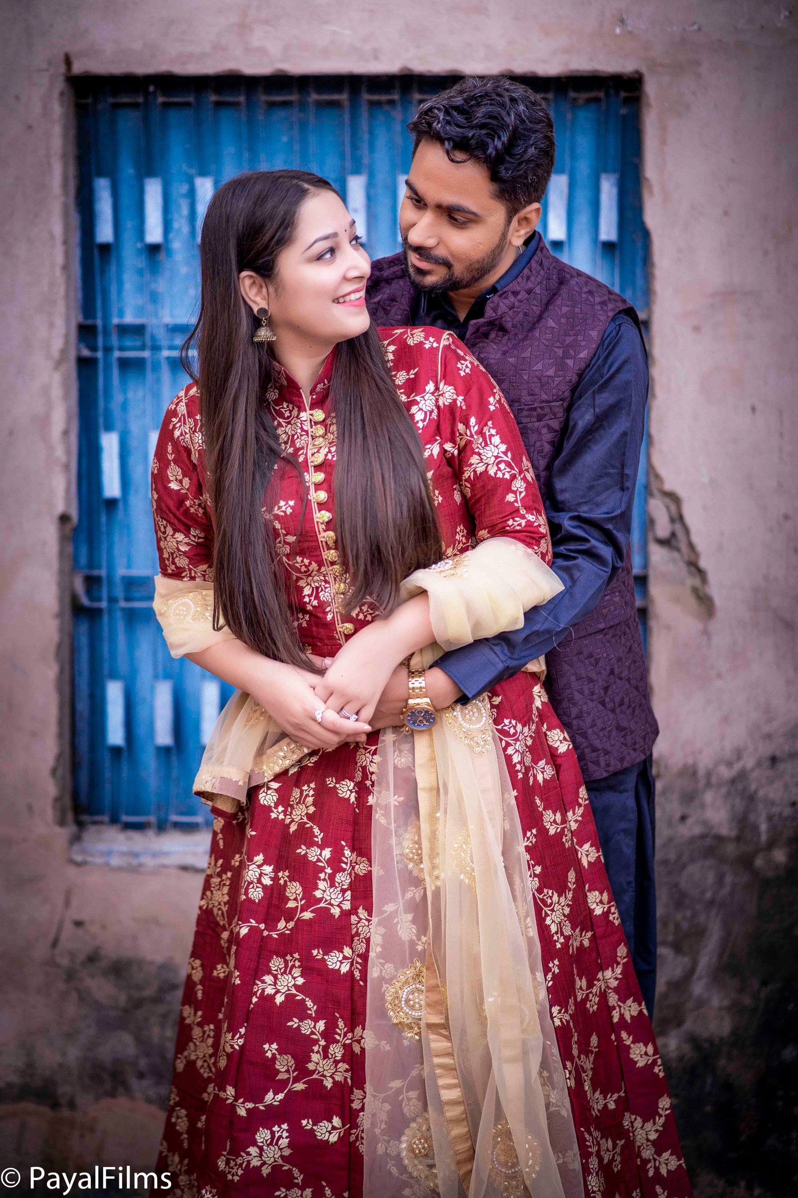 Scenic outdoor couple photoshoot in red gown and suit by Payal Films Bihar
