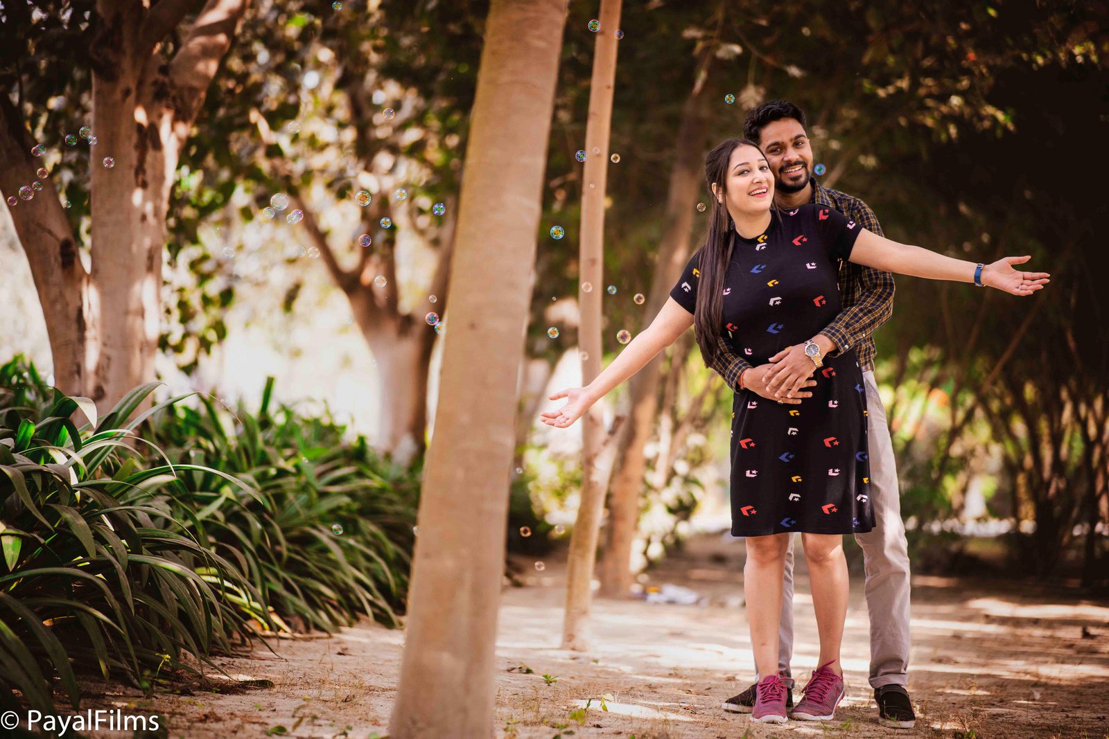 Romantic pre-wedding couple pose with soap bubbles by Payal Films in Khagaria