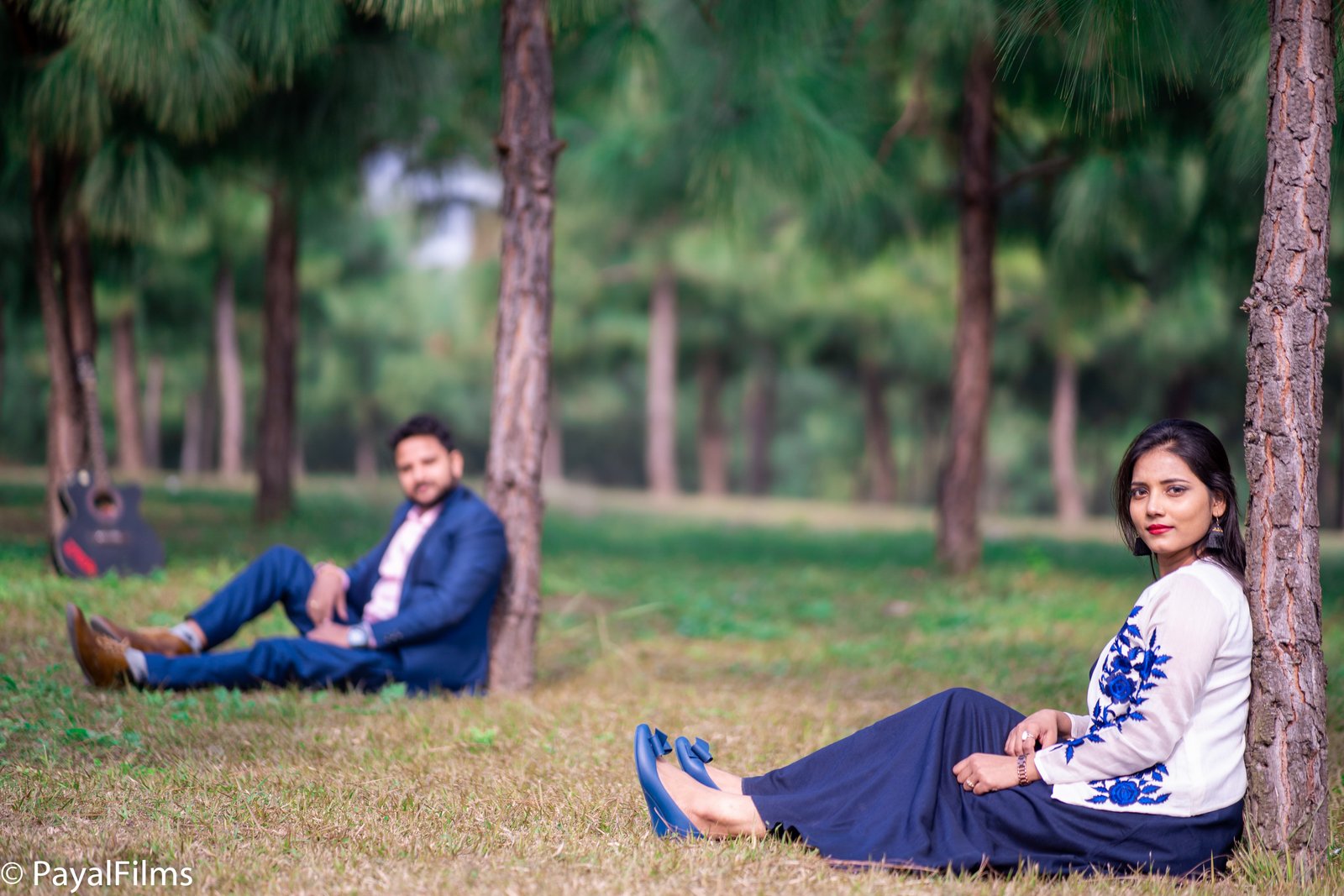 Romantic pre-wedding couple portrait in a pine forest captured by Payal Films in Khagaria.