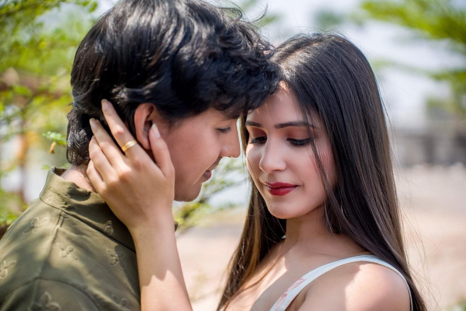 A close-up romantic couple portrait captured by Payal Films Photography in Khagaria, Bihar. The couple shares an intimate moment in soft natural light, showcasing love and connection in this dreamy pre-wedding photoshoot.