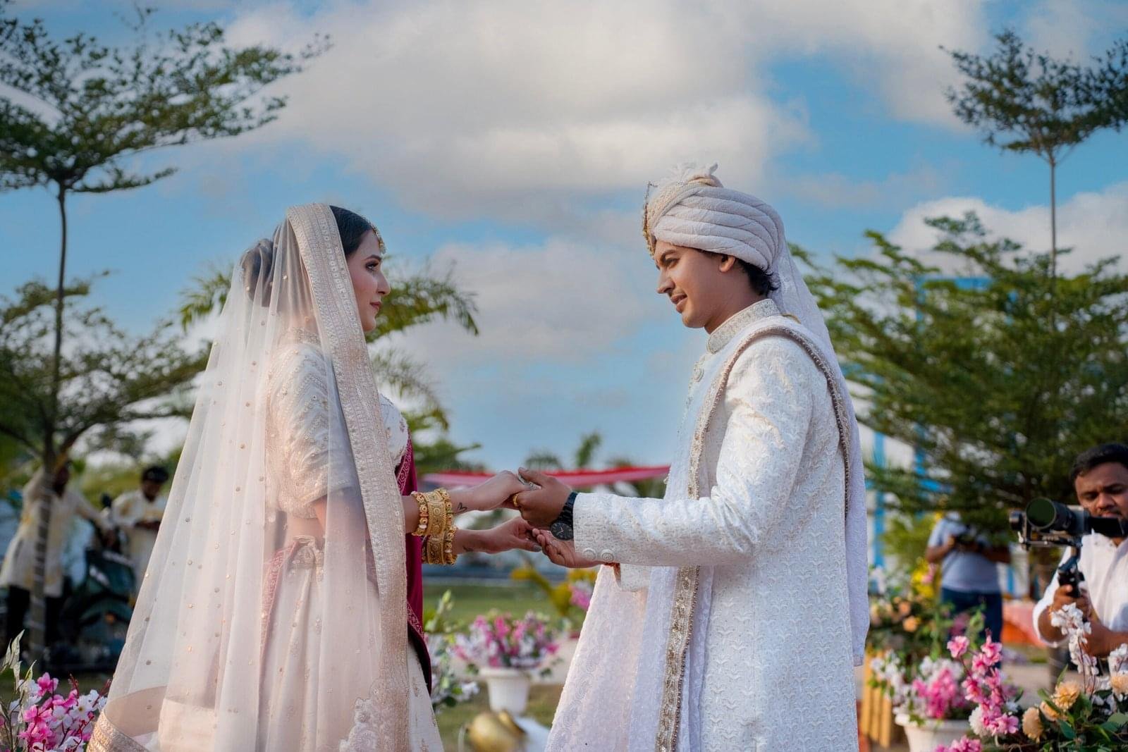 couple traditional attire outdoor wedding - Payal Films Bihar
