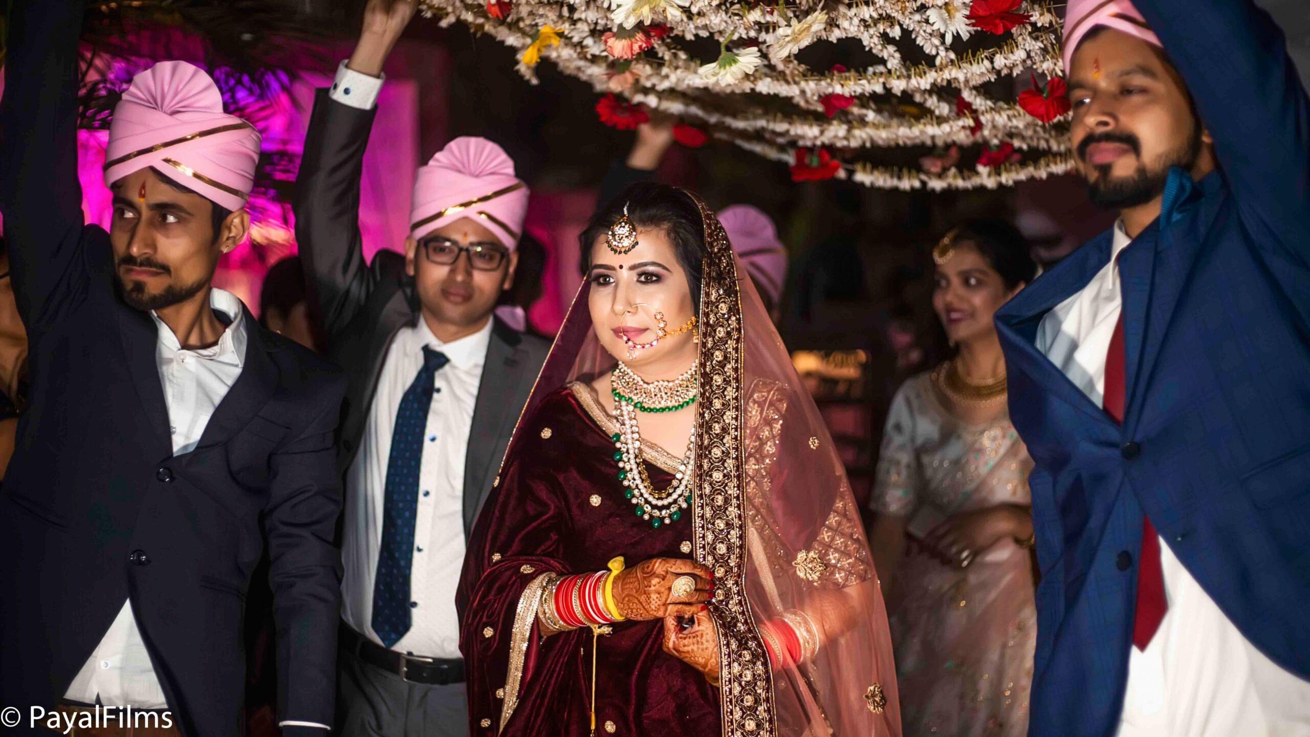 Payal Films bridal entry under floral chadar at traditional wedding ceremony in Bihar