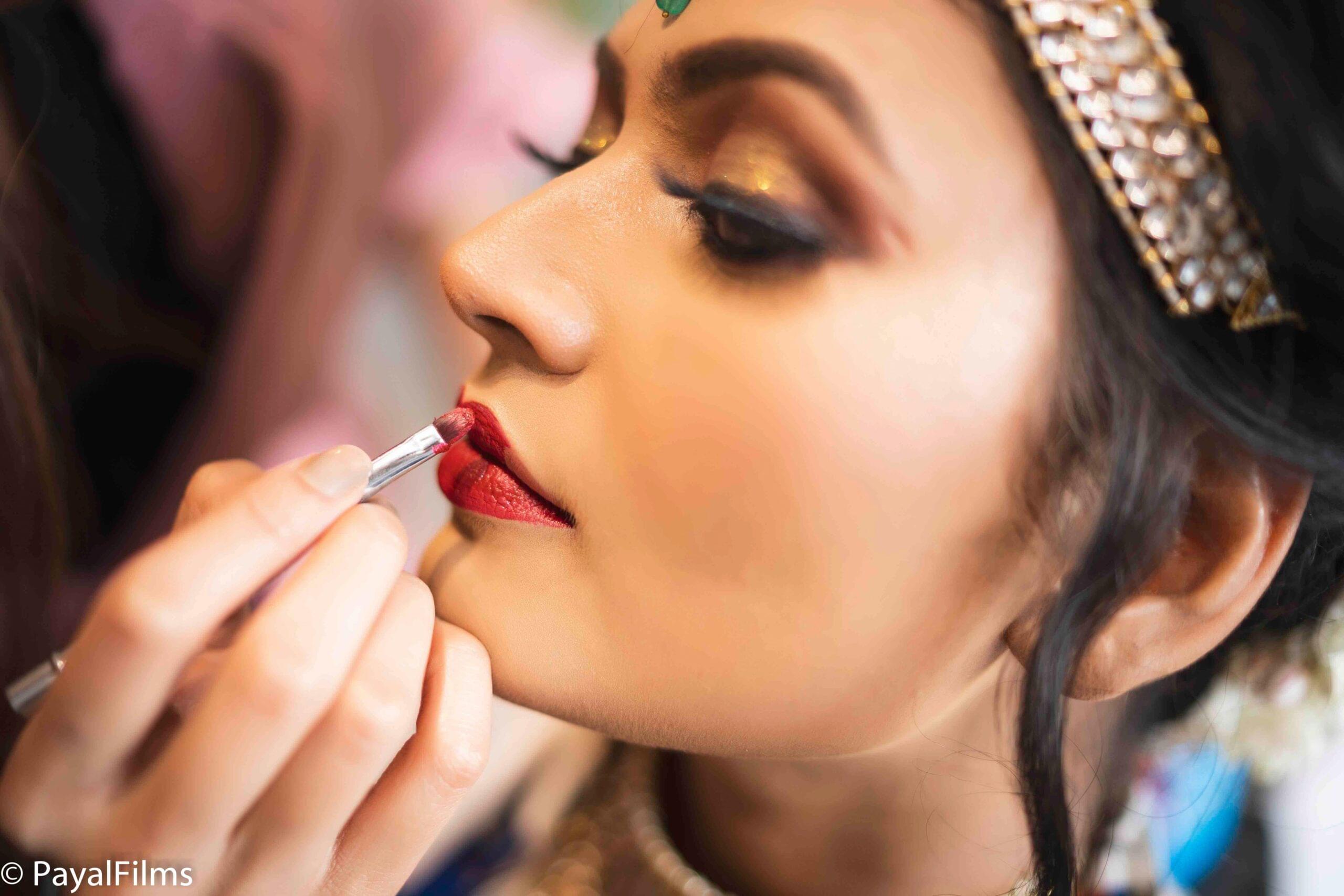 Payal Films close-up shot of bridal makeup being applied at wedding venue in Bihar