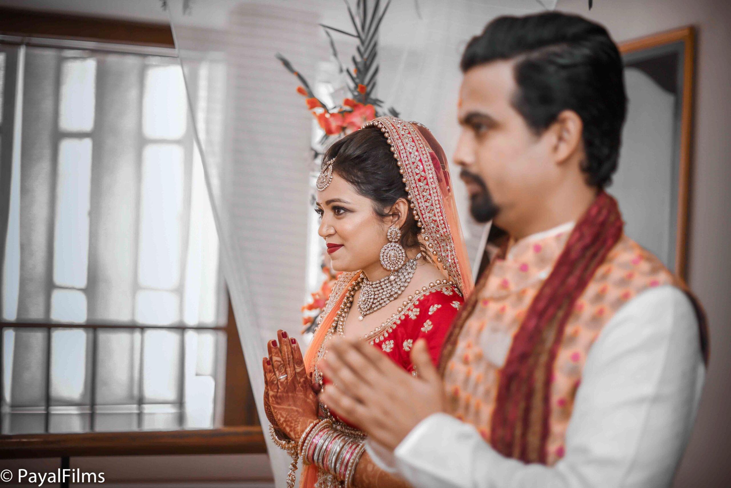 Payal Films Indian wedding couple performing prayer ritual in Khagaria