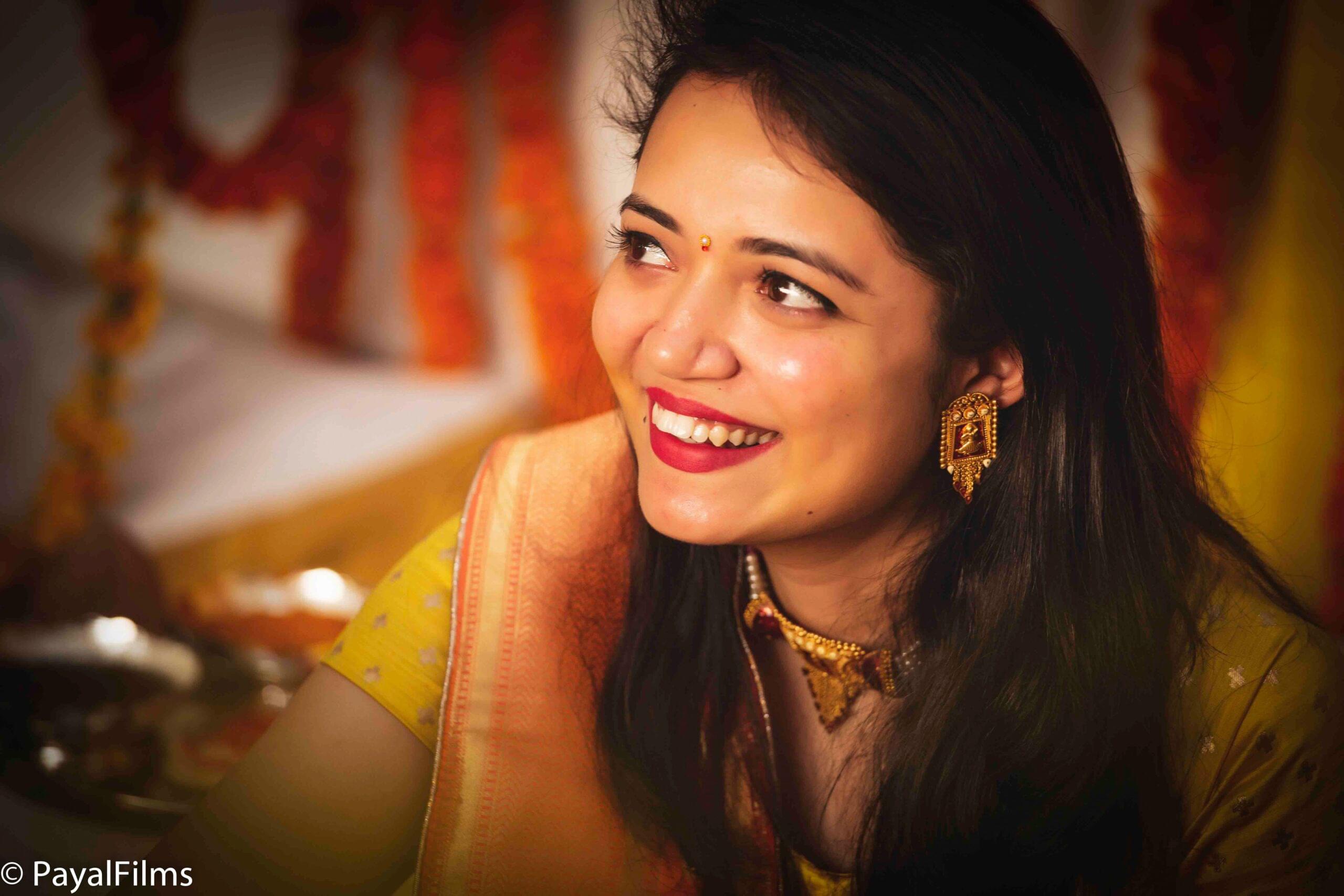 Payal Films close-up bridal portrait in yellow saree and gold jewelry at Bihar wedding