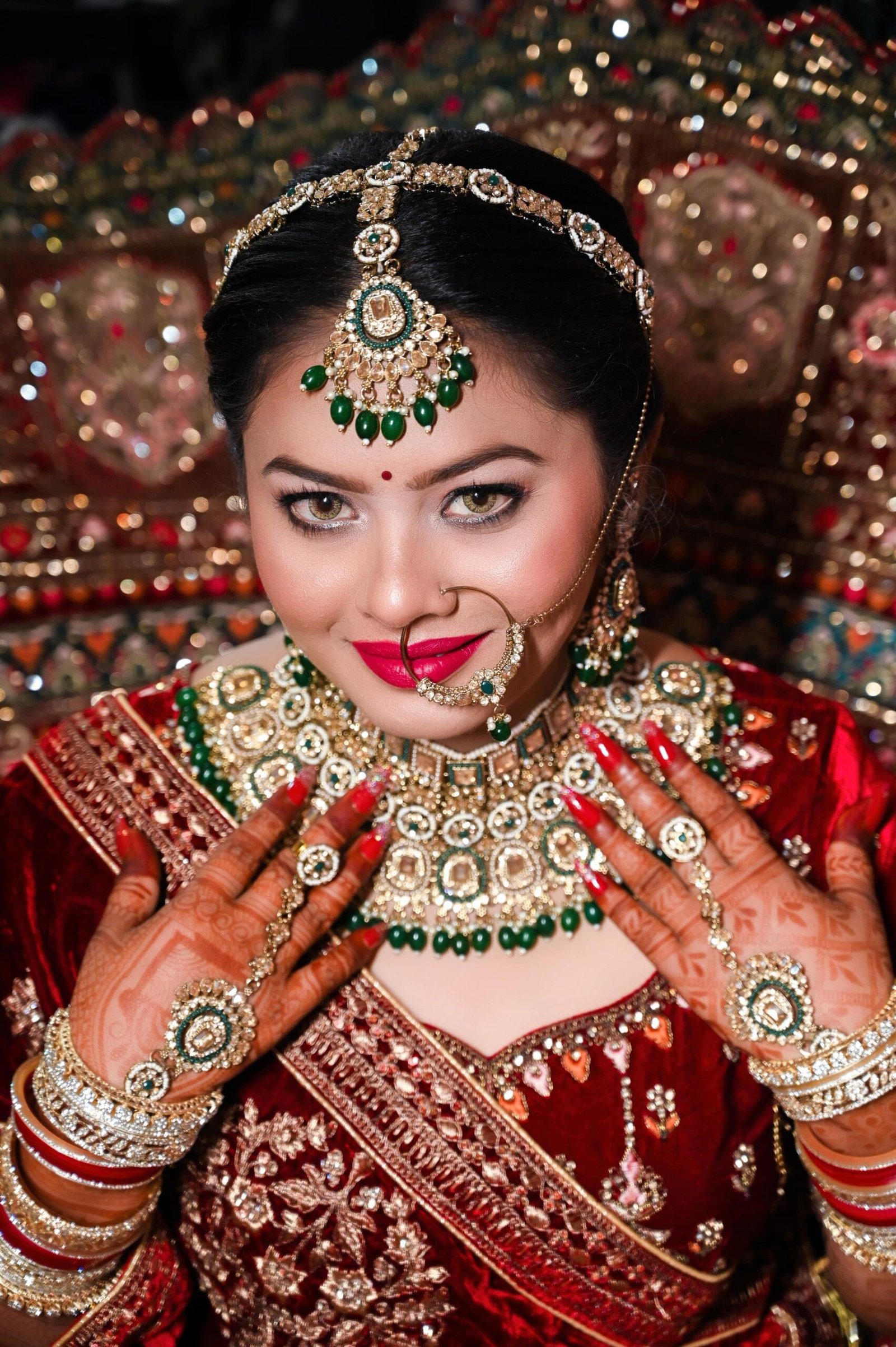 Indian bridal jewellery close up in red lehenga with mehndi hands and necklace, Bhagalpur wedding photography - Payal Films Bihar